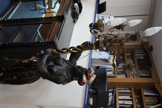 A pair of painted and giltwood blackamoor torcheres, H.6ft